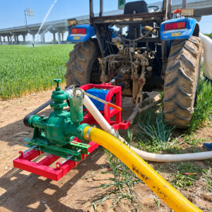 The irrigation pump rotates at the rear of the tractor